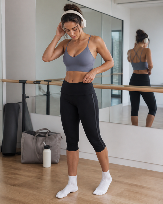 Red Monté haze blue active top and black capri leggings styled in a barre studio mirror fit check