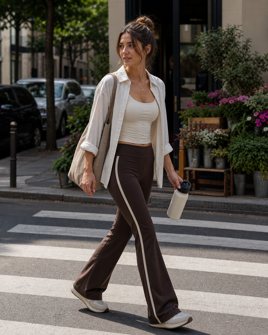 Red Monté coffee brown side-stripe flare yoga pants styled for a city crosswalk after class