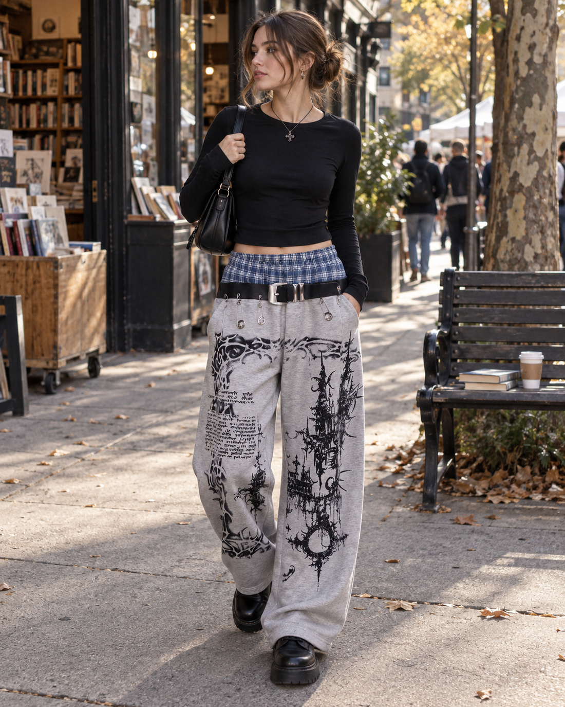 Red Monté plaid-waist graphic wide-leg sweatpants styled with a fitted black top near a bookstore