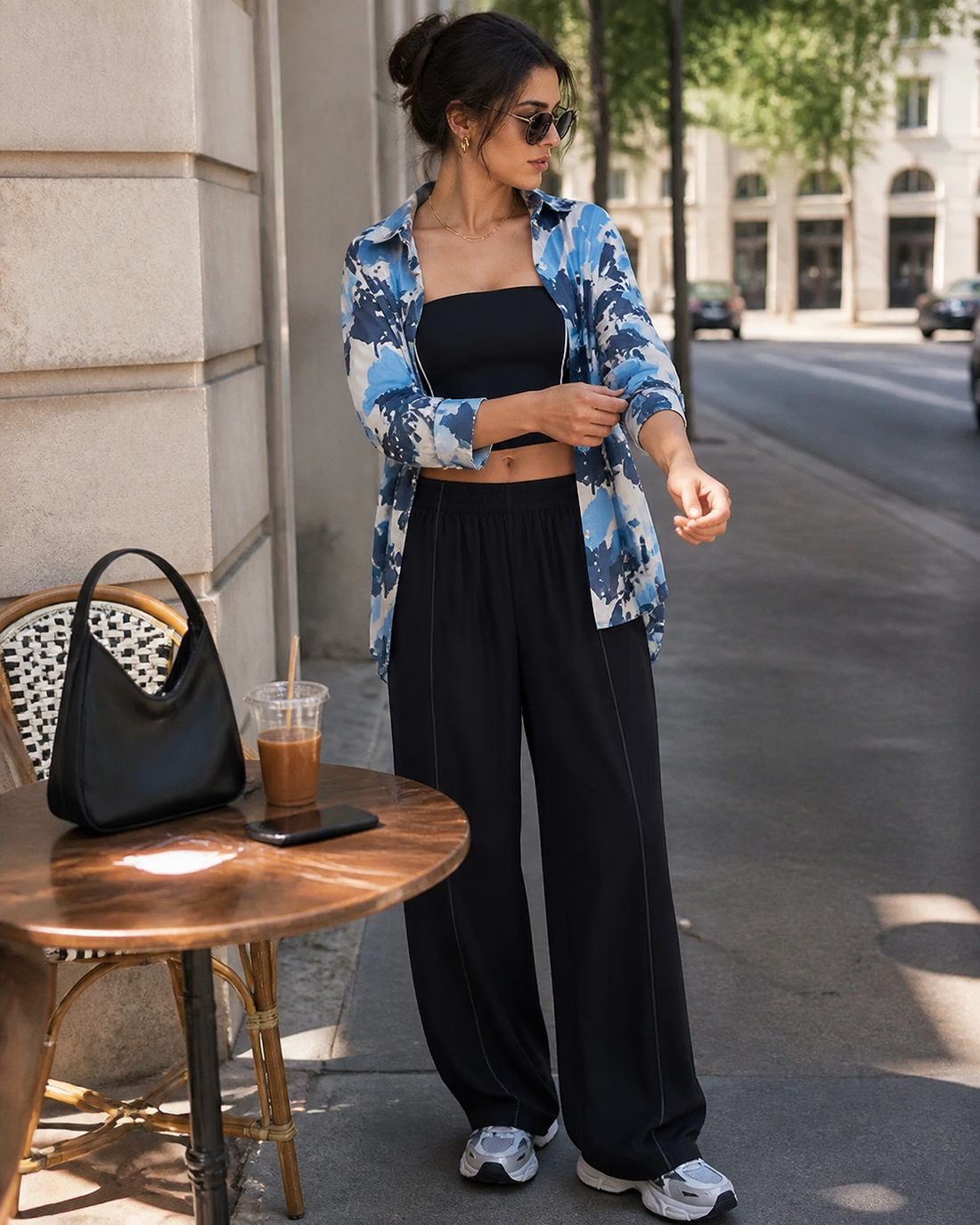 Red Monté blue camouflage ramie shirt layered over a black bandeau active top with black wide-leg pants