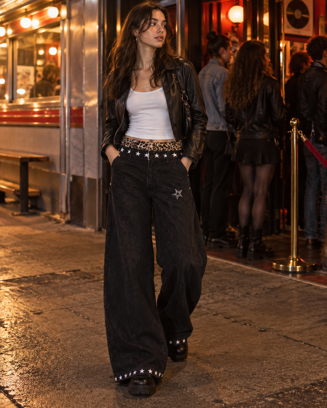 Red Monté black leopard-waist layered jeans styled with a white tank and short jacket at night