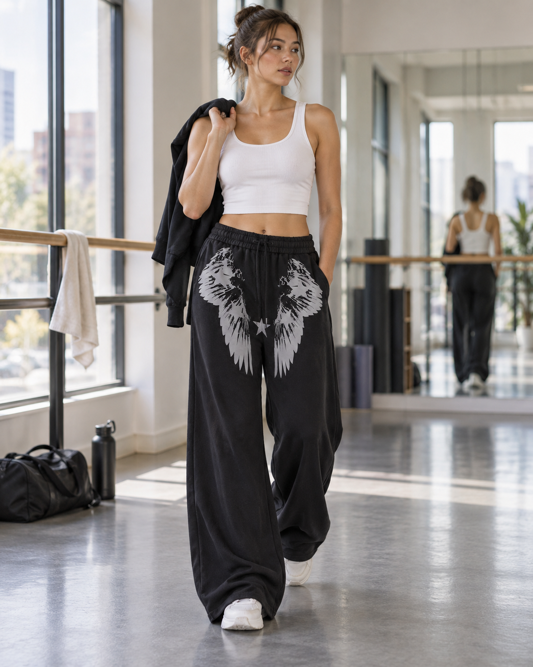 Red Monté black wing star graphic draped jazz pants styled with a white crop tank in a dance studio